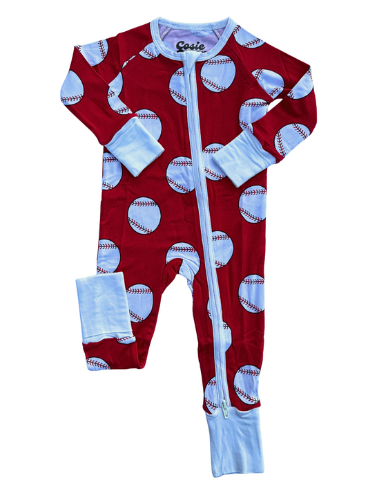 Red baby onesie with baseball pattern on a white background